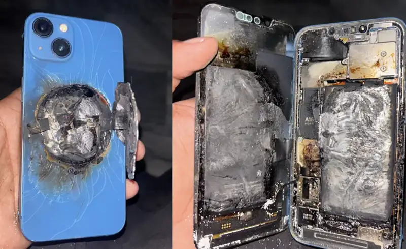 iPhone albastru cu un crater ars in spate si baterie complet carbonizata in interior — exemplu real de baterie aftermarket care a luat foc